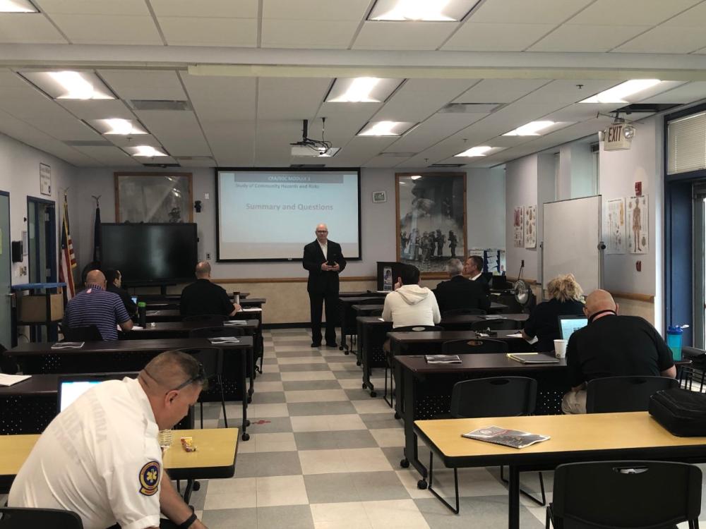 AFD personnel participate in training with Technical Advisor Program (TAP) members as part of the accreditation process.