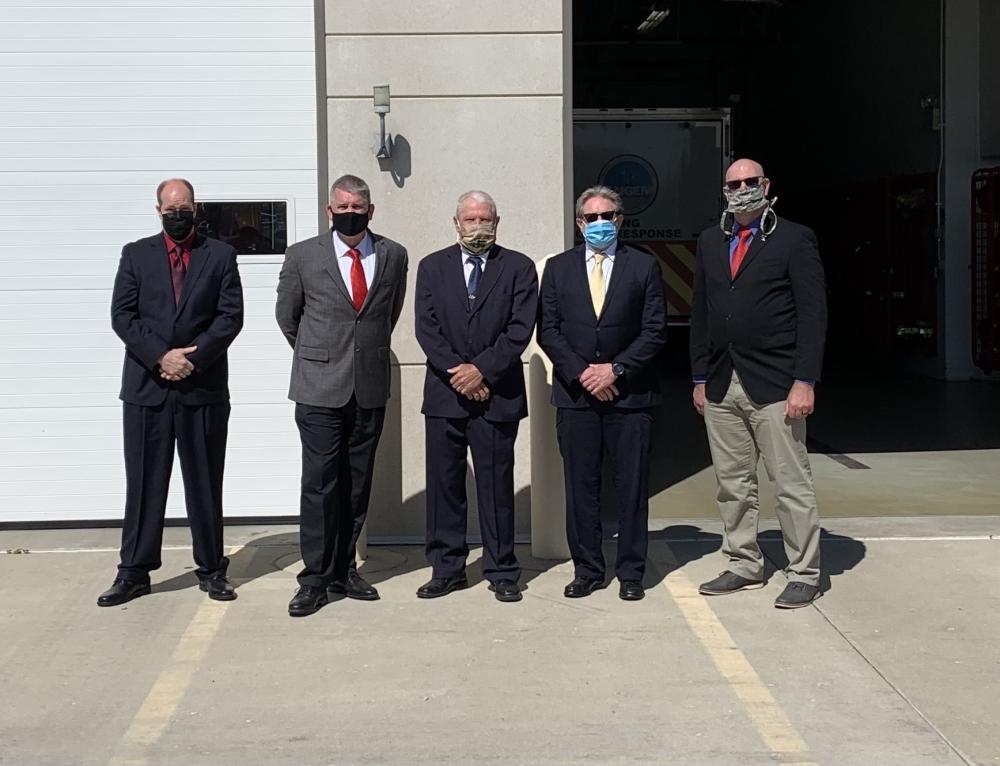 Accreditation Manager Joe Beavan (left) met with other peer assessors to conduct a site visit at an Air Force base in Wisconsin in May 2021.