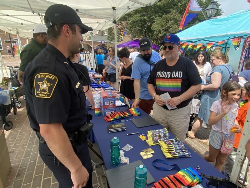 deputy and community members at Pride event at Market Square