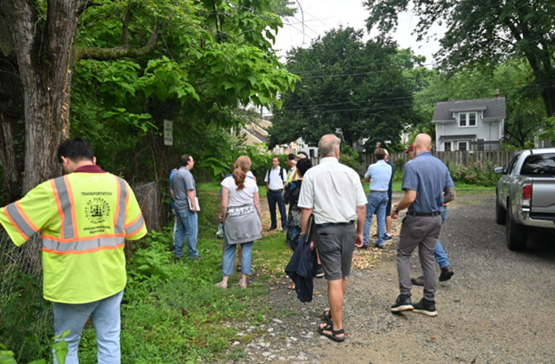 Staff from the City and design team conducted a site walk in July 2023 to understand current flooding patterns as they plan a large capacity flood mitigation project. (City of Alexandria) July 2023.