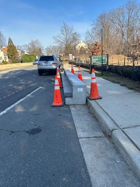 Photo of pre-cast concrete curb waiting to be installed.