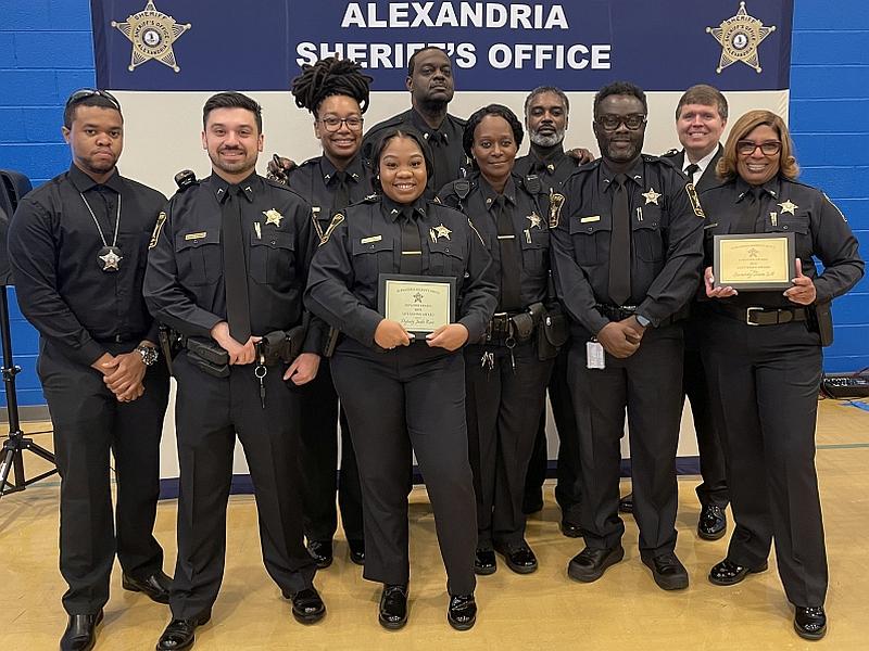 Nine deputies standing with Sheriff at awards ceremony
