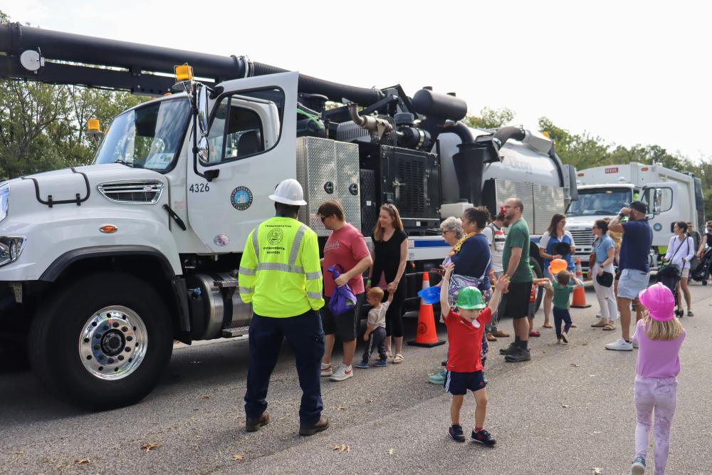 Families gathered around the T&ES truck