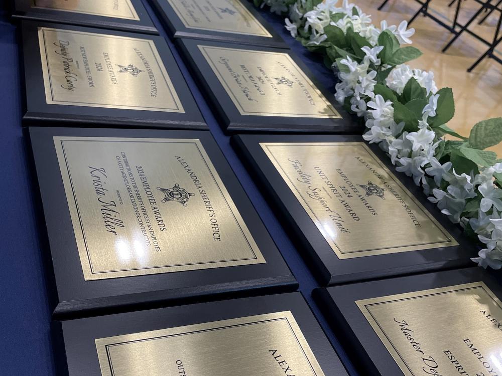 close up of bronze-style plaques flat on a table