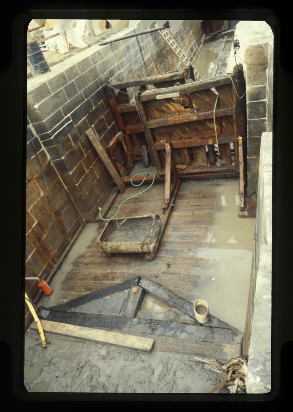 Wooden floor, triangular mitre sill, and lock gates of the excavated tidal lock.