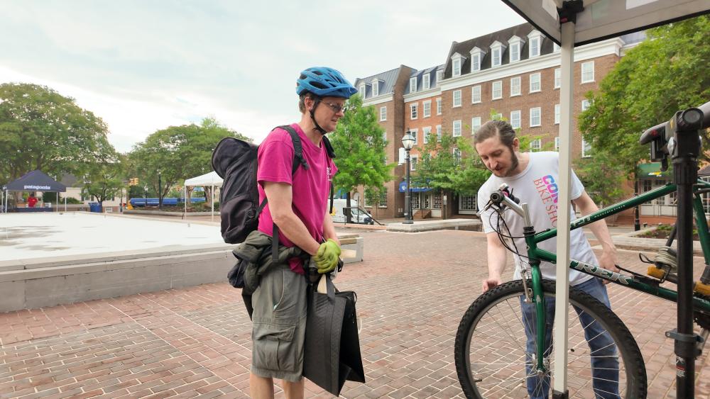 Bikers getting bicycle checked by Conte's Bikeshop