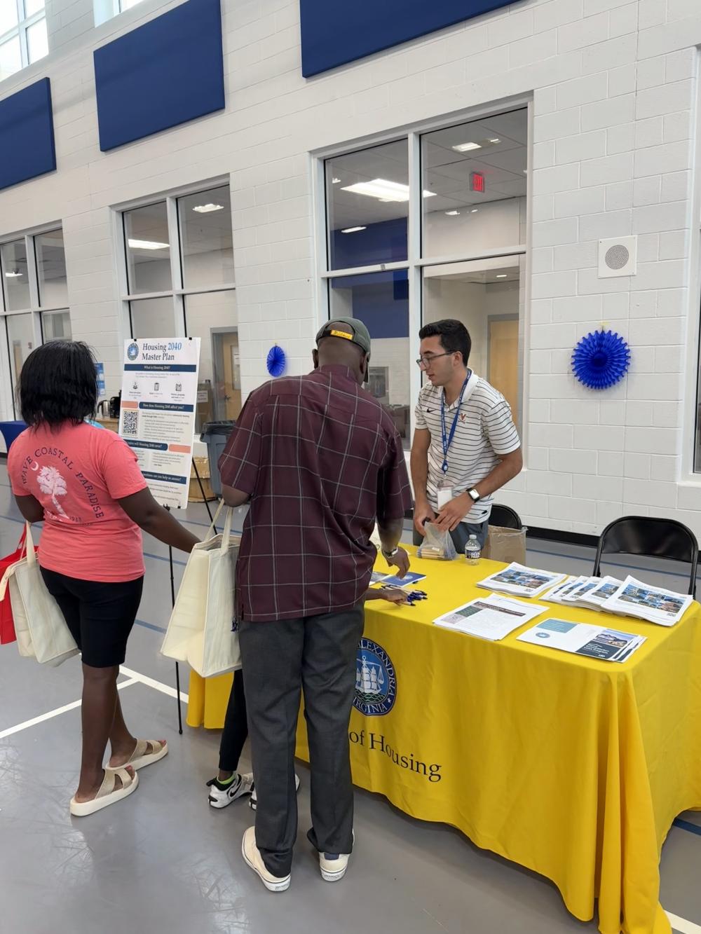 Dominic Ruiz talking to attendees of the Senior Orientation event at Patrick Henry Recreation Center.