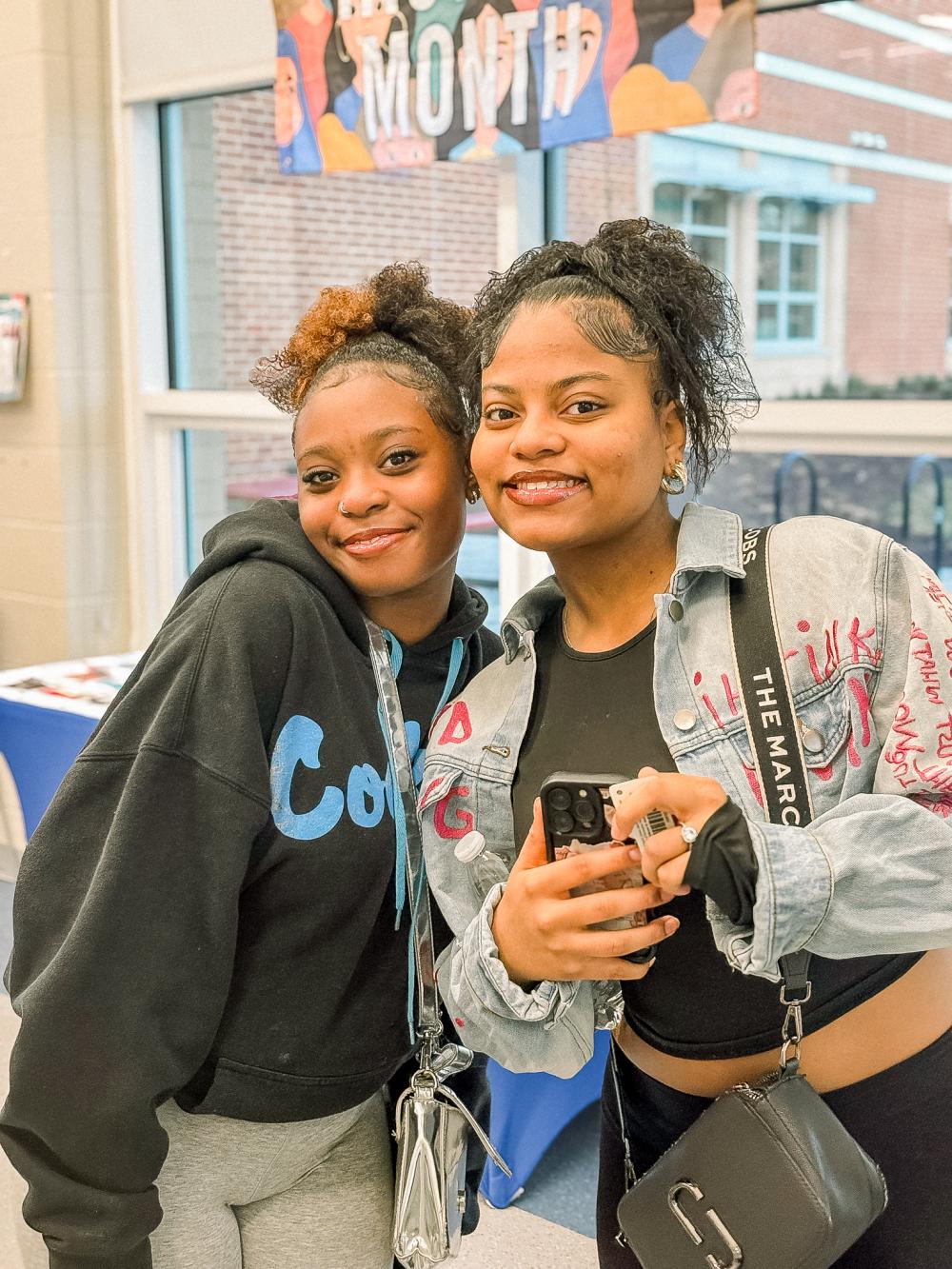 Two teen girls smiling at the camera