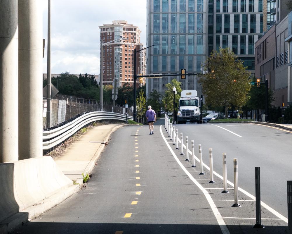 Person jogging in new Mill Road bike lanes. 