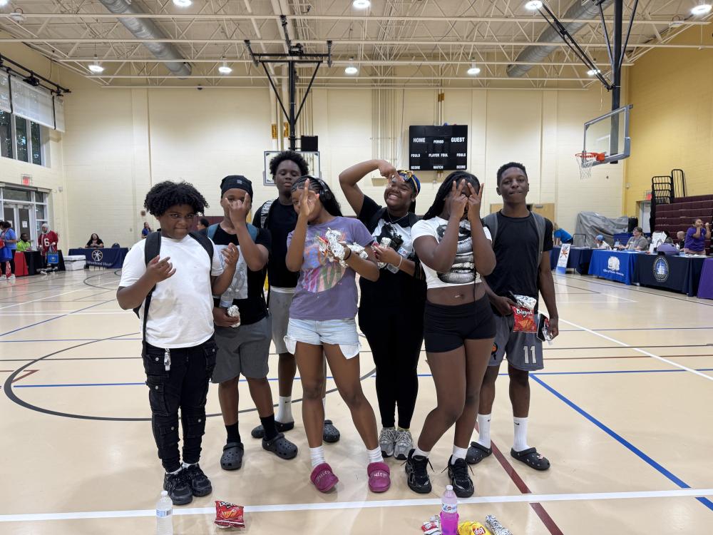 Teenagers posing for the camera inside the Charles Houston Rec Center