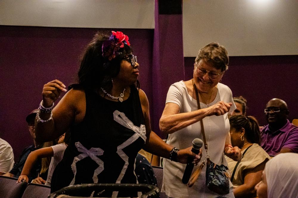 Two women are dancing 