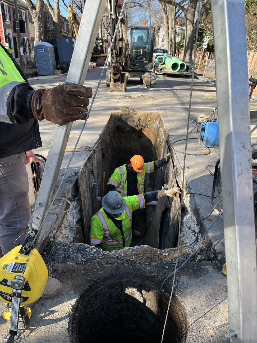 The contractors carefully dig a trench to remove the old pipe and place the new pipe into.  The new pipe connects to an existing manhole on S Royal St. 