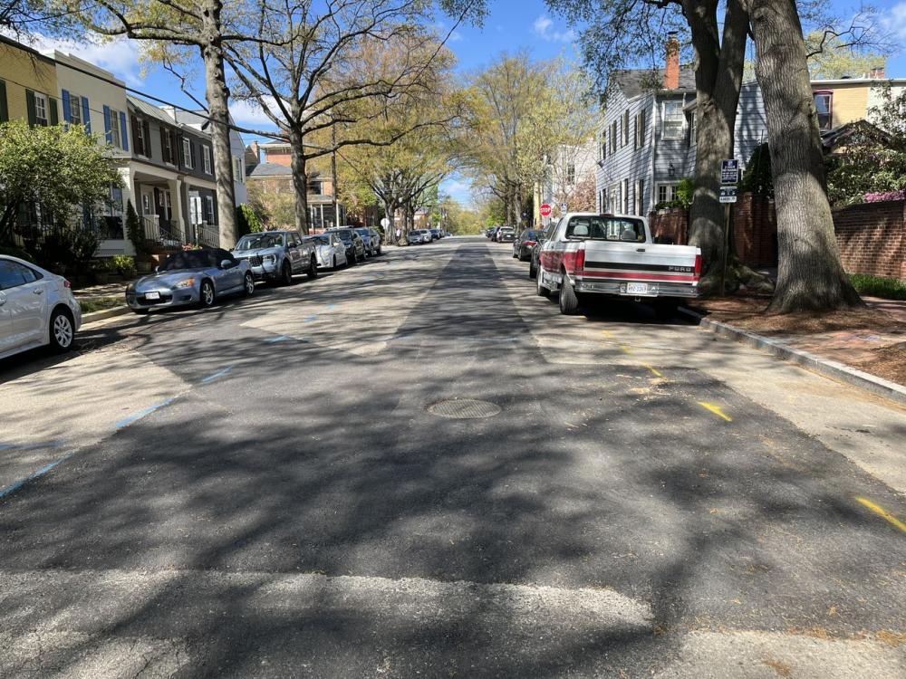 Beneath the new asphalt, the 15" sewer to the left connects into the 21" sewer at the manhole.  The 21" pipe runs the length of the 400 block of Wolfe Street.