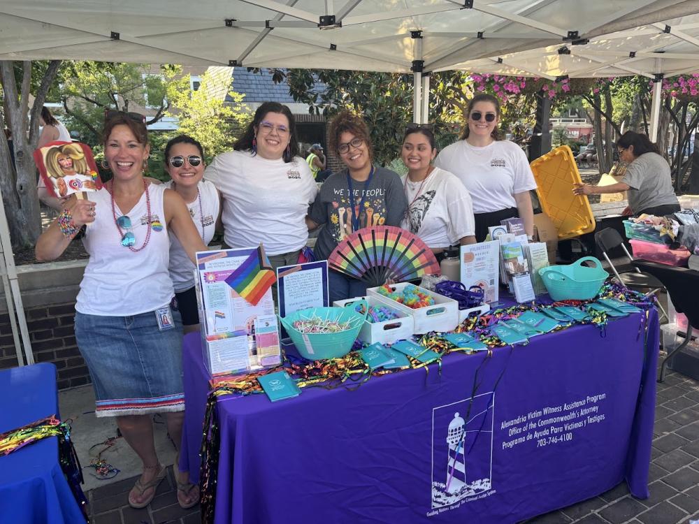 Community partner distributing resource at Alexandria Pride 2026