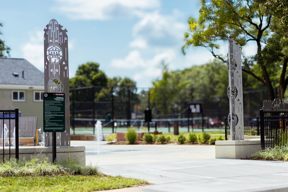 Entrance to the Colasanto Park from the parking lot showcasing the public art display