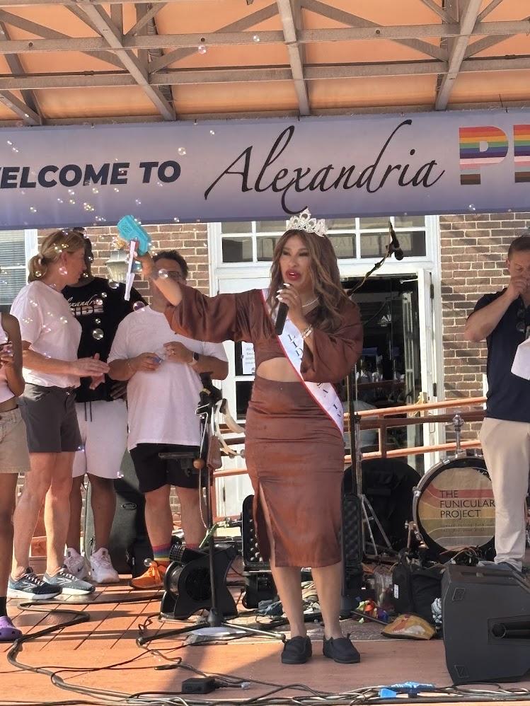 Speaker on stage at Alexandria Pride 2025