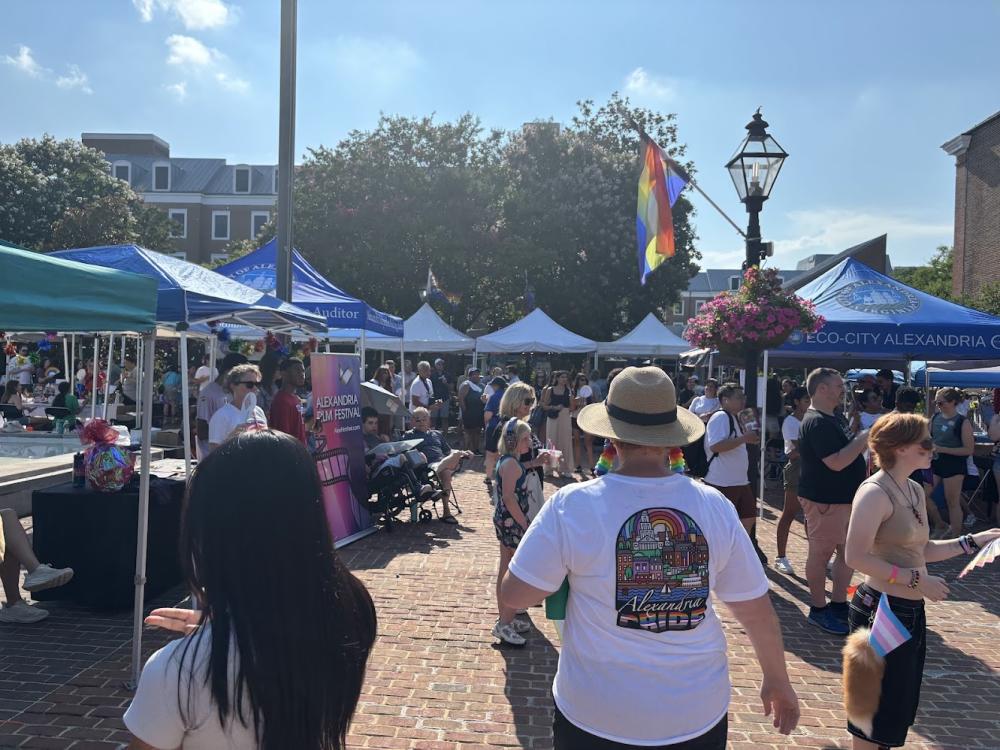 People walking between tents at Alexandria Pride 2025