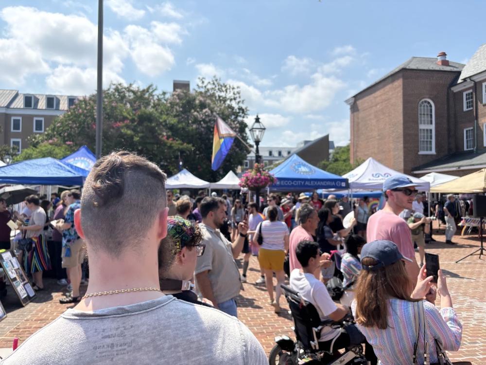 People walking between tents at Alexandria Pride 2025