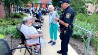 deputy speaking with seniors at outdoor event