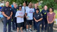 public safety personnel and citizens at block party