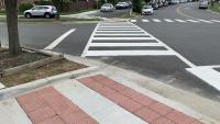 Photo of a pedestrian crosswalk and accessible median refuges on Rayburn Avenue.