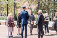 Group of people chatting in a circle prior to the event