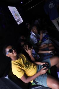 A group of boys playing inside the game truck