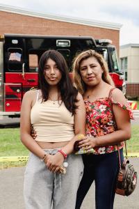 A mother and daughter pose for the camera