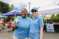 One RPCA staff holding shaved ice and another RPCA staff with a blue hat and sunglasses