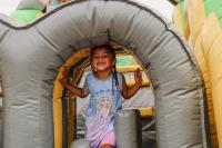 Little girl smiling while on the bounce house
