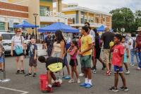 Kids and adults alike waiting for their turn to hit the target on the dunk tank