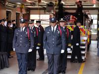 A multi-jurisdictional public safety honor guard moves Deputy Chief Hricik to the carriage of Engine 201 on Saturday, March 11, 2023.