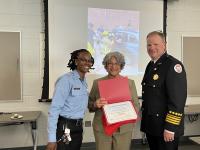 After an 8-week program, Community Fire Academy participants celebrate their accomplishments