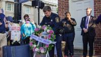 Sheriff Casey places wreath at corner of Fairfax Street