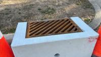 Photo of pre-cast storm drain grate prior to construction.