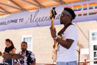 Band member playing bass during performance 