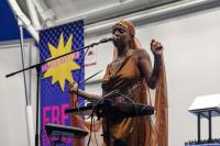 A woman performs a musical piece. 
