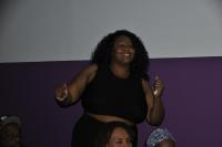 Woman dressed in black dancing 