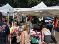 People walking between tents at Alexandria Pride 2025