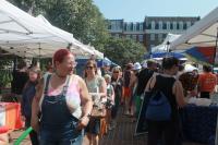 People walking between tents at Alexandria Pride 2025
