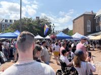 People walking between tents at Alexandria Pride 2025
