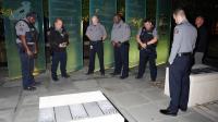 APD officers gather in prayer at the fallen officers memorial outside Police Headquarters, honoring those who gave their lives in service to Alexandria.