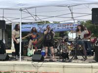 Band on stage at Alexandria Pride 2026