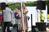 Speaker on stage at Alexandria Pride 2026