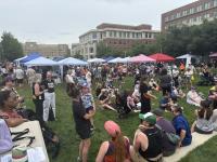 People gathered in grassy area for Alexandria Pride 2026