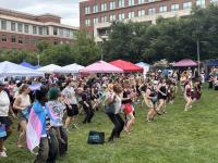 Large group line dancing at Alexandria Pride 2026