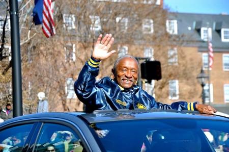 A. Melvin Miller waving from a car sunroof during a parade. Courtesy Erika Miller