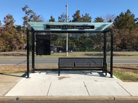 bus shelter with bench at Westbound King Street and Bradlee Shopping Center