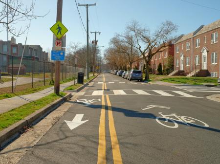 Photography of completed East Glendale Avenue contraflow bike lane and high-visibility crosswalks.