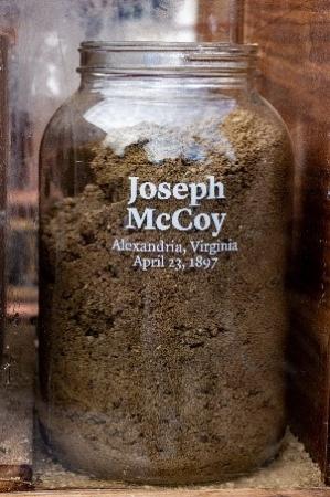 Jar filled with soil, labeled Joseph McCoy, Alexandria, Virginia, April 23, 1897